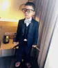 Nieuwe Collectie Jongen Tuxedos Sjaal Black Revers Kinderen Pak Navy Blue / Wine Kid Wedding / Prom Suits (jas + Vest + Broek + Stropdas + Shirt) NH4