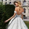 A-Line Off Shoulder Bröllopsklänningar Märke Crystal Design Appliqued Full Long Long Bridal Dress Sexig Sheer Backless Glamorösa bröllopsklänningar