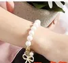 Hot Selling New Fashions Vacker Pearl Bow Ny Armband Pearl Bracelet Bow Armband Gratis Frakt med spårningsnummer