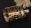 European New fashion style gold plated alloy opened cuff hollow out bangle bracelets for women jewelry