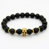 2015 New Products Whole 10pcs lot Beaded 8MM Lava stone beads 24K Gold Skull Elastic Bracelets for Men and Women's Gift241g