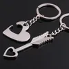 Vente en gros - 10pcs / lot Favors de mariage et cadeaux Sword of Cupid Heart Keychain douche nuptiale Souvenirs de mariage pour les invités