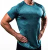 Nuovi vestiti fitness a 8 colori Abbigliamento sportivo traspirante ad asciugatura rapida da uomo Allenamento da corsa Calzamaglia elastica alta Abbigliamento sportivo a maniche corte