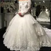 Luxury Princess Långärmad Bröllopsklänning 2019 Jewel Lace Applique Beaded Tulle Skirt Ball Gown Bride Bridal Dresses Plus Storlek Turkiet