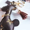 Portachiavi di design in pelle PU Ciondolo animale Borsa Charms Portachiavi Regalo di moda carino Accessori per gioielli Giraffa di cartoni animati Portachiavi Porta anello