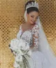 New Arabic Sexy Luxury Mermaid Wedding Dresses Lace Appliques Beaded Crystal Illusion Long Sleeves Overskirts Detachable Train Bridal Gowns