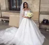Affascinante dubai Arabo A Line Abiti da sposa Elegante con spalle scoperte mezze maniche 2019 Abiti da sposa in pizzo economici Vestido