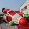 vendita all'ingrosso Babbo Natale gonfiabile di Natale all'aperto alto 5 m con la decorazione natalizia della sospensione della parete esterna del centro commerciale