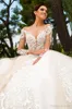 Nieuwe vintage champagne kanten jurk illusie lange mouwen lange mouwen backless Dubai African Bridal Jury Sweep trein trouwjurken 0430