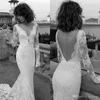 Ny Liz Bohemian Martinez Mermaid Dresses Sheer Long Sleeve Lace Applique Bridal Dress Sexig V Neck Backless Boho Bröllopsklänningar