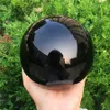 2020 1pcs Natural heavy Natural Black Obsidian Sphere Large Crystal Ball Healing Stone Foe Home Decoration317t