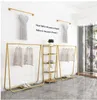 Visa rack av fashionabla järnkläder rack kommersiella möbler landning stil tyg butik enkel kombination typ klädshylla