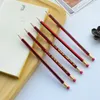 30 pcs / lote Lápices de madera de color rojo Shanghai lápices HB con borrador de papelería Mirui con cubo de almacenamiento