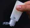 Bottiglia di plastica PET disinfettante per le mani vuota da 30 ml con bottiglia a forma di trapezio con tappo a scatto per flaconi di campioni liquidi disinfettanti per struccante