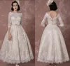 Snörning bröllopsklänning 2020 Vintage Bateau Champagne Halv ärmar Bröllopklänning En linje Baklösa Te Längd Sash Reception Bridal Dress