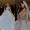 Luxury Arabic Sheer Long Sleeves Satin Ball Gown Bröllopsklänningar 2020 Dubai Beaded Crystals Ruched Chapel Train Bröllop Bröllopklänningar CPH044