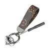 Porte-clés de styliste en cuir PU, corde pour sacs, sangles de téléphone portable, breloques suspendues au cou, petit cadeau créatif, activité de luxe