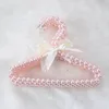 Appendiabiti per vestiti con fiocco in perline di perle di plastica Matrimonio per bambini Bambini Scaffale per riporre lo spazio salvaspazio