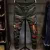 Erkek Jean Pantolon Vent Phoenix Broderie Jeans Homme Noir Mince Petit Tube Droit Armée Vert Trou Rouge Salopette Élastique