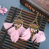 Creative new rice bead earrings super fan-shaped long feather earrings female European and American jewelry wholesale