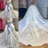 2020 New Sexy Mermaid Wedding Dresses Jewel Neck Illusion Lace Appliques Beaded Long Sleeves Overskirts Detachable Train Formal Bridal Gowns