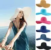 夏の女性のビーチストローの帽子19色の太陽の帽子のレディースワイドブリムストロー帽子屋外の折りたたみ式ビーチパナマ帽子