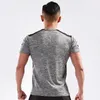 Mężczyźni Trening T Koszulki Szybki Suchy Krótki Rękaw Na Zewnątrz Trening Outdoor Sportswear Tee Oddychająca Mesh Running Bodybuilding Koszula Mężczyzna