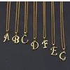 Nouveau créateur de mode de luxe plaqué or cuivre diamant étincelant zircon lettres court collier pendentif ras du cou pour femmes hommes