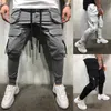 Мужские Joggers Повседневная Брюки Фитнес Мужчины Спортивная одежда Косцейстраз Нижние днища Тощие Свенные Успонаватели Брюки Мужской Черный Джоггер