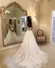 graceful lace long sleeves wedding dresses sheer bateau neck lace covered buttons bridal gowns sweep train tulle robe de marie