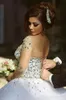 2020 Luxury Crystals Long Sleeves Ball Gowns Wedding Dresses Rhinestones Lace Up Backless Arabic Bride Gown Sheer Neck Vestidos De8817850