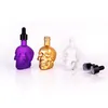 Nyaste 45ml Färgglada Pyrex Glass Skull Storage Bottle Juice Tom E cig Dropper Container Portable För E-Cigarette Vape Oil