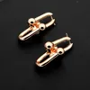 Venta caliente Fashion Lady 316L Titanio acero Letra T 18K chapado en oro en forma de U Pendientes de cadena larga 3 colores