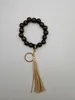 Foreign trade personalized hand-woven wooden bead elastic rope bracelet Korean version of velvet tassel pendant keychain