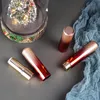 Tubo per rossetto sfumato pressato tondo in plastica da 12,1 mm, strumento per il trucco vuoto Pacchetto di conservazione per balsamo per labbra professionale F3748