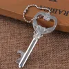 50pcs / lot nyckelformad flasköppnare Keychain Zinc Alloy Key Ring Beer Bottle Opener Unique Creative Wedding Party Gift Favorit