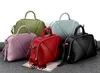 Designer-ny koreansk fashionabla singel-axel läder dam väska med enkel elegant geometri handväska med snett strängdel
