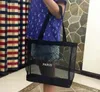 Hot! Klassisk vit logotyp Shopping Mesh Bag Luxury Pattern Resväska Kvinnor Tvättväska Kosmetisk Makeup Storage Mesh Casedhl