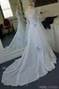 Abiti da sposa celtici vintage Una linea maniche lunghe a giulietta Allacciatura sul retro Fiori fatti a mano Scollo rotondo Custom Made Sweep Train Weddin224l