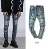 Мода-Высокая улица Мужчины разорванные стройные пригодные джинсы Западное колено RUMS REBLESTED Длинные брюки Урожай светло-голубые брюки