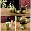 Antika seramik Japon sake set içkisi 1 şişe pot kalça şişesi 4 bardak şarap hediyeleri el boyalı Çin kaligrafisi kaderi siyah yeşil