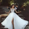 2019 Abiti da sposa sexy senza schienale Applique in pizzo Sheer JewelNeck senza maniche Abito da sposa con spacco laterale Glamorous Dubai Chiffon Brid1957480