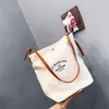 Mulheres bolsas casuais bolsas de ombro de ombro amigável letra portátil Padrão de bolsas para estudantes bolsa de compras marrom