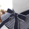 الحواف قبعة حار بيع الأزياء أسود أبيض مقلم BOWKNOT شمس الصيف قبعة جميلة المرأة سترو شاطئ هات كبيرة