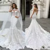 Luxury Beach Mermaid Bröllopsklänningar med Caped Sexig Lace Appliques Fishtail Tåg Land Bröllopsklänningar 2020 Plus Storlek Boho Brudklänningar
