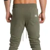 Ny designer Casual man Solid Gym Training Pants Sportkläder Joggare Sportbyxor Män Running Swearing Sweatpants med M-2XL