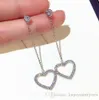 Groothandel- mode designer luxe diamant zirkoon zoete schattige mooie hart lange hanger Dangle kroonluchter oorbellen voor vrouw meisjes