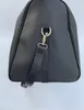 Bolso de viaje de cuero de gran capacidad de 50CM para mujer, bolsos de lona de hombro de calidad para hombre, remaches inferiores para equipaje con cabezal de bloqueo