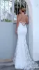 Ny vit v-hals sexig bröllopsklänningar trumpetskede Baklösa spets-up sopa tåg kjol ärmlös spets applique romantiska brudklänningar