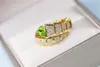 Wholesale-gold and green natural olivine springy design jewelry diamond rings lucky auspicious sacred attractive exaggerated circle